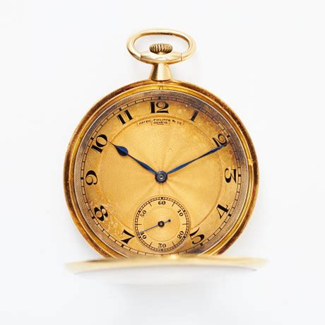 PATEK PHILIPPE, fickur, 18 k guld, ca 1918. 